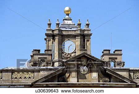 Stock Image - Blenheim Palace, Woodstock, near Oxford, Oxfordshire, England. Clock on roof. Fotosearch