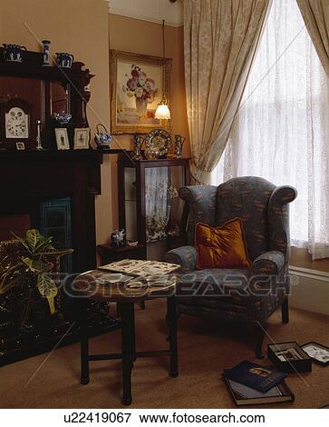 Blue armchair in traditional living room View Large Photo Image Stock Photo - Blue armchair in traditional living room. Fotosearch