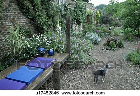 Blue cushions on wooden bench in country garden in summer View Large Photo Image Stock Photograph - Blue cushions on wooden bench in country garden in summer. Fotosearch
