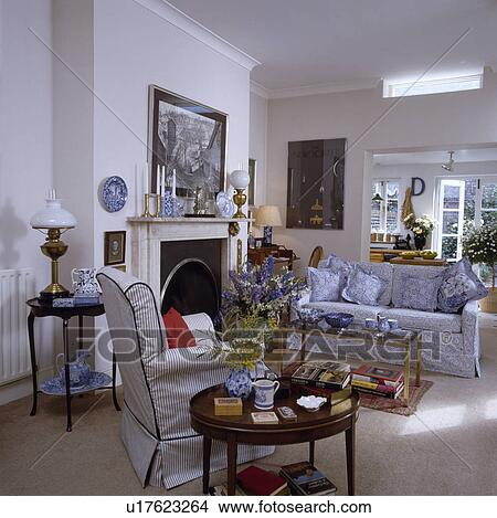 Blue floral sofa and armchair in traditional living room View Large Photo Image Picture - Blue floral sofa and armchair in traditional living room. Fotosearch