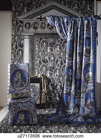 Blue neoclassical patterned curtain and chair with matching loosecover against black neoclassical wallpaper View Large Photo Image Stock Photograph - Blue neoclassical patterned curtain and chair with matching loosecover against black neoclassical wallpaper . Fotosearch