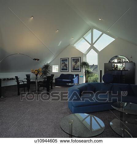 Blue sofas in modern attic conversion living room View Large Photo Image Stock Photography - Blue sofas in modern attic conversion living room. Fotosearch