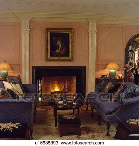 Blue sofas in traditional living room with picture above fireplace View Large Photo Image Stock Image - Blue sofas in traditional living room with picture above fireplace. Fotosearch