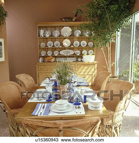 Stock Image - chair, interior, houseplant, dresser, blue, furniture. Fotosearch