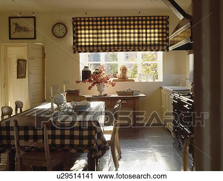 Checked blind and blue checked cloth on table in country kitchen with slate flooring View Large Photo Image Stock Image - Checked blind and blue checked cloth on table in country kitchen with slate flooring. Fotosearch