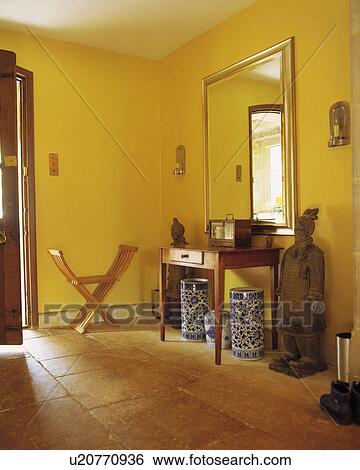 Chinese warrior sculpture in yellow country hall with flagstoned floor and blue+white Chinese vases View Large Photo Image Stock Photograph - Chinese warrior sculpture in yellow country hall with flagstoned floor and blue+white Chinese vases. Fotosearch