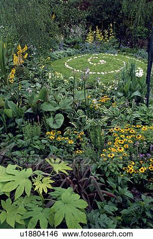 Circular lawn with stone paved pattern in small country garden in summer View Large Photo Image Stock Photograph - Circular lawn with stone paved pattern in small country garden in summer. Fotosearch