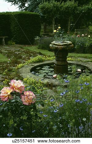 Circular pond in country garden View Large Photo Image Stock Image - Circular pond in country garden. Fotosearch