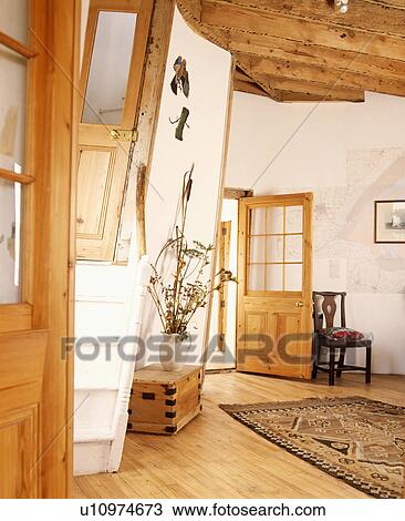 Circular white hall in converted lighthouse with wooden floor and sloping walls View Large Photo Image Stock Image - Circular white hall in converted lighthouse with wooden floor and sloping walls. Fotosearch