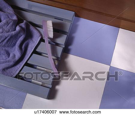 Close-up of blue and white floor tiles and wooden bath mat View Large Photo Image Stock Photo - Close-up of blue and white floor tiles and wooden bath mat. Fotosearch