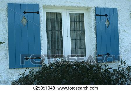 Close up of blue wooden shutters on cottage window View Large Photo Image Stock Photo - Close up of blue wooden shutters on cottage window. Fotosearch