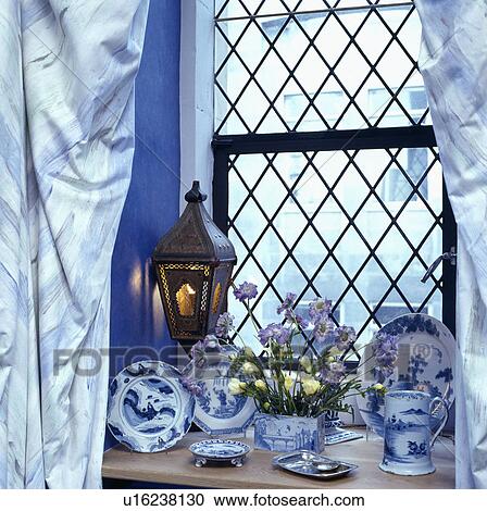 Close-up of blue+white china on windowsill View Large Photo Image Stock Image - Close-up of blue+white china on windowsill. Fotosearch