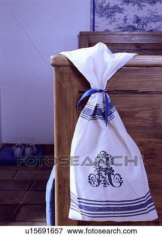 Close-up of blue+white laundry bag on wooden bed View Large Photo Image Stock Photo - Close-up of blue+white laundry bag on wooden bed. Fotosearch