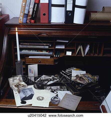 Close-up of books and photographs on antique desk View Large Photo Image Stock Image - Close-up of books and photographs on antique desk. Fotosearch