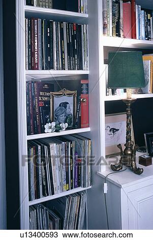 Close-up of books on white shelves View Large Photo Image Stock Image - Close-up of books on white shelves. Fotosearch