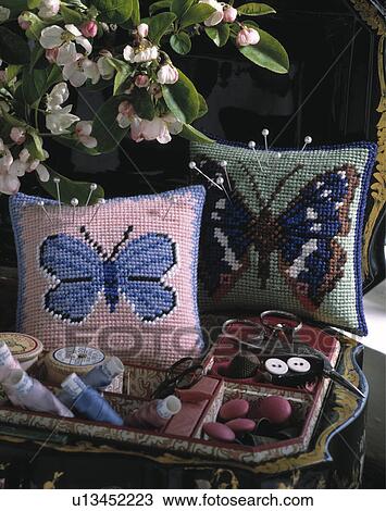 Close-up of butterfly motif cross-stitch cushions View Large Photo Image Stock Image - Close-up of butterfly motif cross-stitch cushions. Fotosearch