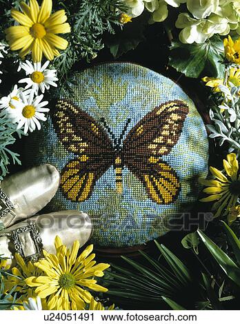Close-up of butterfly motif cross-stitch cushion View Large Photo Image Stock Image - Close-up of butterfly motif cross-stitch cushion. Fotosearch