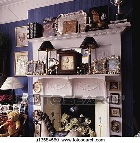 Close-up of cluttered white Edwardian fireplace View Large Photo Image Stock Image - Close-up of cluttered white Edwardian fireplace. Fotosearch