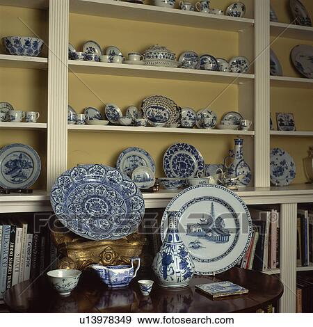 Stock Photo - Close-up of collection of blue+white china on shelves. Fotosearch
