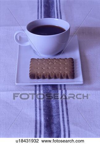 Close up of cup of coffee and biscuit on rectangular white plate on white cloth with blue stripe View Large Photo Image Stock Image - Close up of cup of coffee and biscuit on rectangular white plate on white cloth with blue stripe. Fotosearch