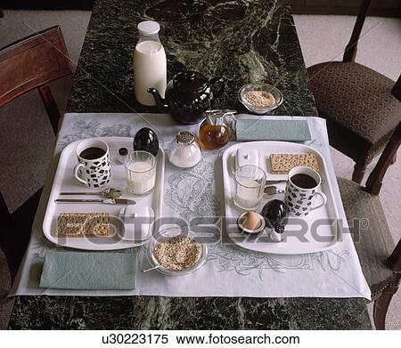 Stock Photography - Close-up of cups and ryvita on rectangular plastic trays on table. Fotosearch