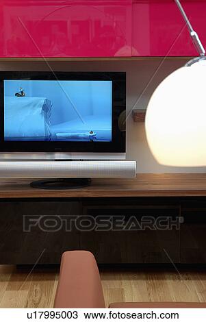 Close-up of flat-screen television against red background View Large Photo Image Stock Image - Close-up of flat-screen television against red background. Fotosearch