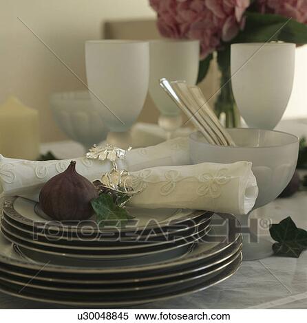 Close-up of fresh fig and embroidered white napkin on stack of white plates with black edge View Large Photo Image Stock Photography - Close-up of fresh fig and embroidered white napkin on stack of white plates with black edge. Fotosearch