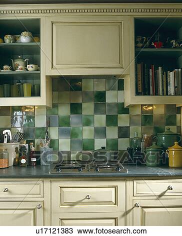 Stock Photo Of Close Up Green Wall Tiles Above Hob Built In To Close Up Of Green Wall Tiles Above Hob Built In To Kitchen Worktop Cream