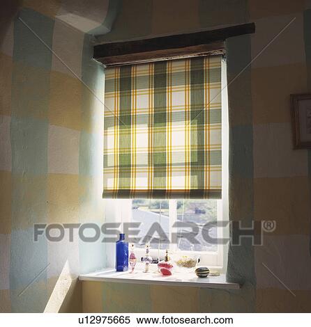 Stock Photography - Close-up of green+yellow checked blind on window. Fotosearch