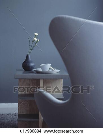 Close-up of grey Arne Jacobsen Egg chair and modern table View Large Photo Image Picture - Close-up of grey Arne Jacobsen Egg chair and modern table. Fotosearch