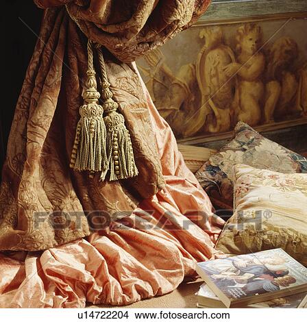 Close-up of large tassel on tapestry and pink silk curtains View Large Photo Image Picture - Close-up of large tassel on tapestry and pink silk curtains. Fotosearch
