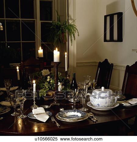 Close-up of lighted candles and silver cutlery with antique china and wineglasses on oak table View Large Photo Image Stock Photography - Close-up of lighted candles and silver cutlery with antique china and wineglasses on oak table. Fotosearch