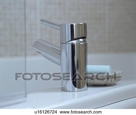 Close-up of modern chrome bathroom tap View Large Photo Image Picture - Close-up of modern chrome bathroom tap. Fotosearch