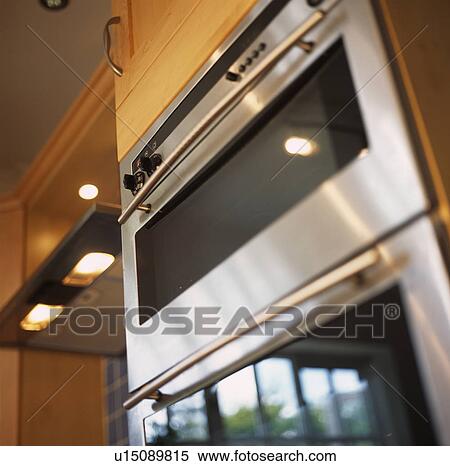 Stock Photography - Close-up of modern stainless steel oven. Fotosearch