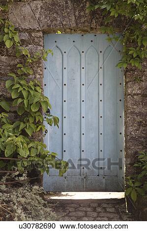 Close-up of old wooden door in wall View Large Photo Image Stock Image - Close-up of old wooden door in wall. Fotosearch