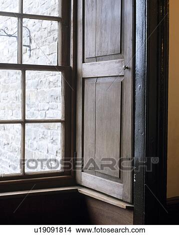 Picture - Close-up of old wooden shutter at sash window. Fotosearch