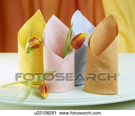 Close-up of pastel coloured table napkins folded in mitre shapes View Large Photo Image Stock Image - Close-up of pastel coloured table napkins folded in mitre shapes. Fotosearch
