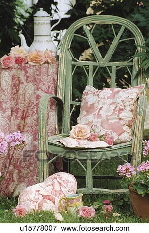 Close-up of pink cushion on green chair View Large Photo Image Stock Photo - Close-up of pink cushion on green chair. Fotosearch