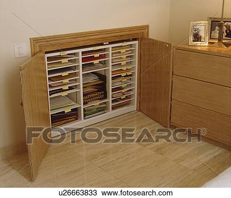 Close-up of plans shelving with open doors View Large Photo Image Stock Image - Close-up of plans shelving with open doors. Fotosearch