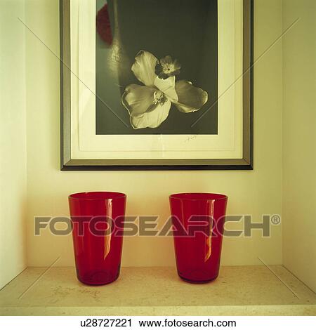 Close-up of red glasses on shelf below black+white photograph View Large Photo Image Stock Image - Close-up of red glasses on shelf below black+white photograph. Fotosearch