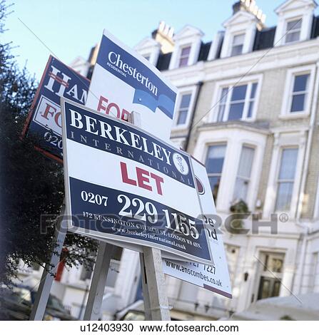 Close-up of To Let sign boards with terraced houses in background View Large Photo Image Stock Image - Close-up of To Let sign boards with terraced houses in background. Fotosearch