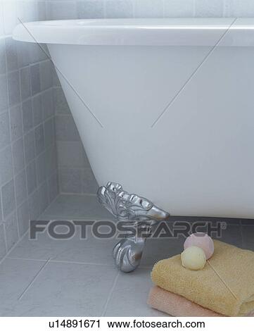 Close-up of white claw foot bath on grey tiled floor View Large Photo Image Stock Image - Close-up of white claw foot bath on grey tiled floor. Fotosearch