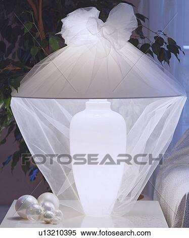 Close-up of white lamp covered with white muslin View Large Photo Image Stock Photography - Close-up of white lamp covered with white muslin. Fotosearch