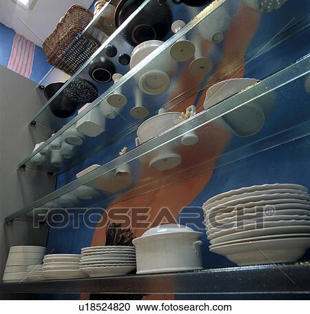 Close-up of white plates and crockery on glass shelves View Large Photo Image Stock Image - Close-up of white plates and crockery on glass shelves. Fotosearch