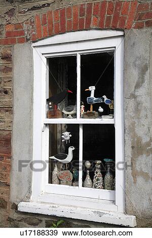 Close up of wooden seabirds in window View Large Photo Image Stock Photo - Close up of wooden seabirds in window. Fotosearch