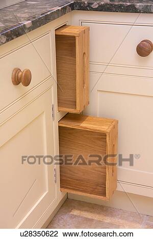 Close-up of wooden trays stored below kitchen worktop View Large Photo Image Stock Image - Close-up of wooden trays stored below kitchen worktop. Fotosearch