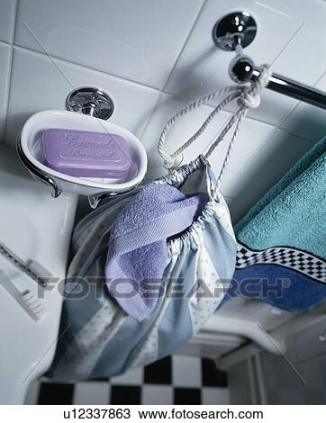 Closeup of washbag, soap and towels in white bathroom View Large Photo Image Stock Image - Closeup of washbag, soap and towels in white bathroom. Fotosearch