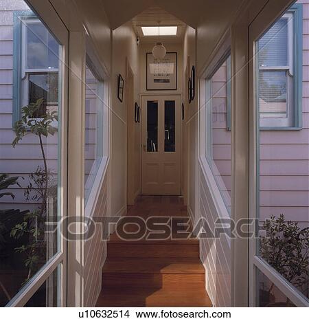 Picture - Covered entrance to weatherboard house. Fotosearch