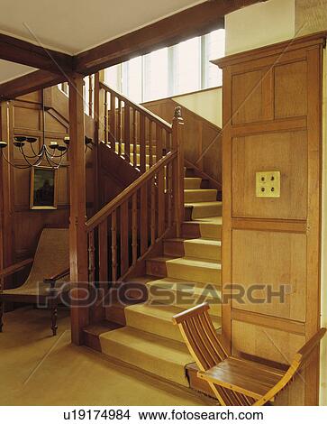 Cream carpet on wooden staircase in panelled hall View Large Photo Image Picture - Cream carpet on wooden staircase in panelled hall . Fotosearch