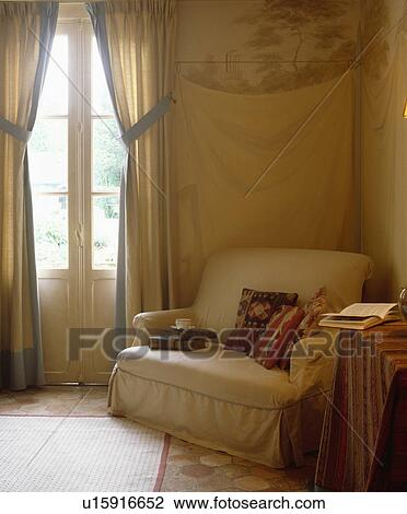 Cream loosecovers on armchair in traditional living room View Large Photo Image Stock Image - Cream loosecovers on armchair in traditional living room. Fotosearch